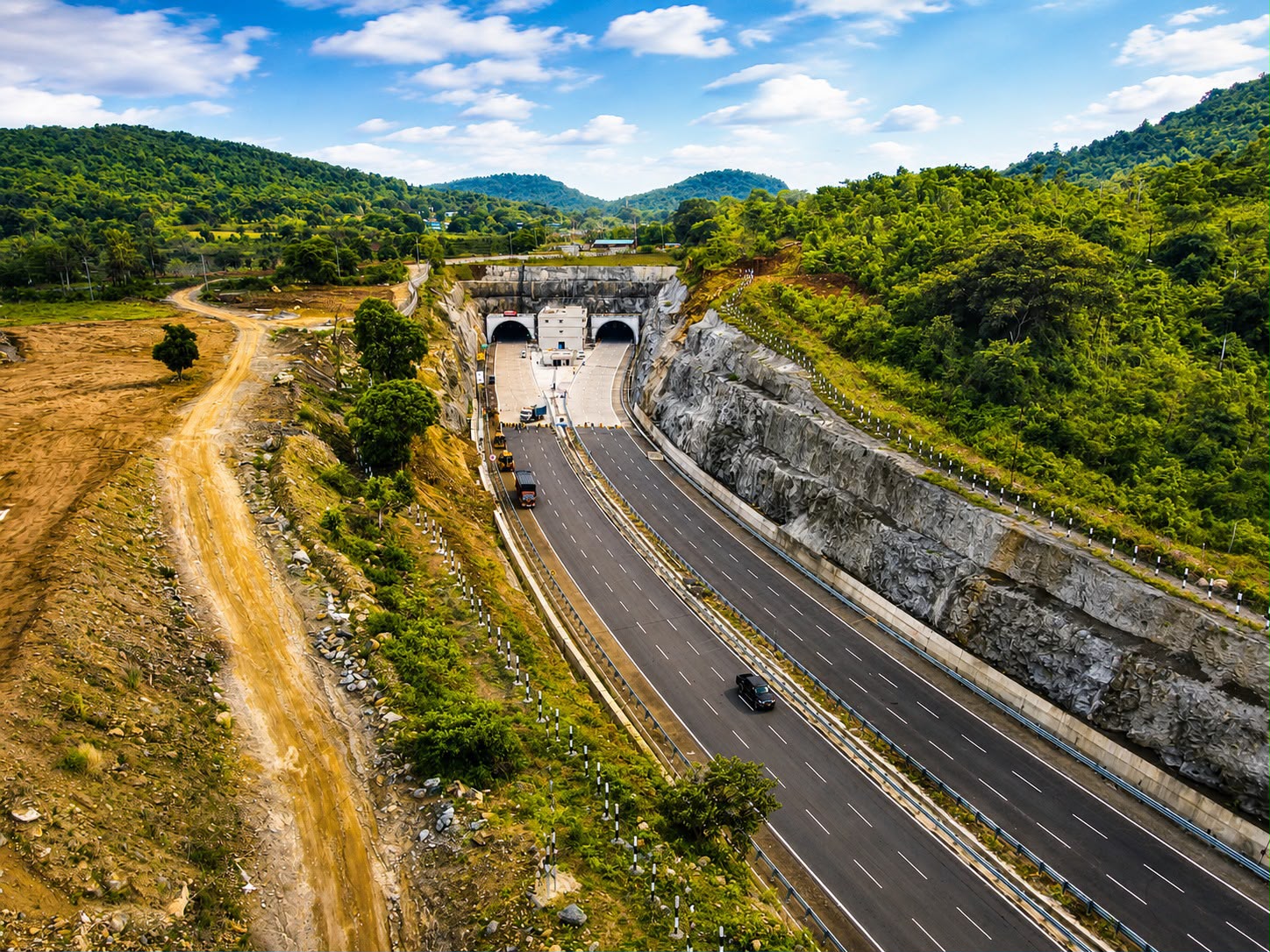 Aerial view of the twin tunnel portals and six-lane approach, NH-130-CD